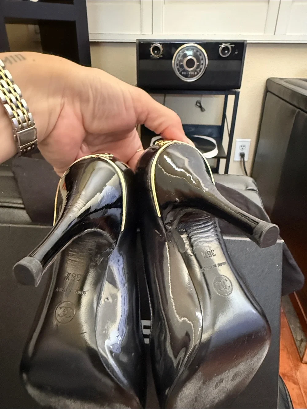 CHANEL Black Patent Peep-Toe Stiletto Pumps with Gold CC Heel Accent
